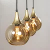 chique_lichts_hanglamp_zw_2.webp Clearance Straluma Chique 3-lichts hanglamp zwart/goud met amber glas