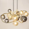 grote_hanglamp_goud_met_a_2.webp Best Straluma Grote hanglamp goud met amber/smoke glazen bollen