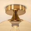 plafondlamp_goud_met_ambe_2.webp Clearance Straluma Plafondlamp goud met amber glazen bol 30 cm